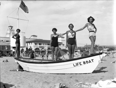 Models standing on a life boat