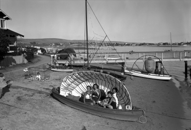 Models in a boat decorated for the Tournament of Lights