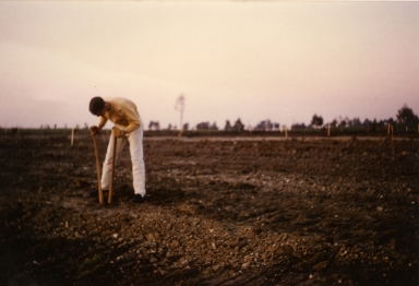 Steven Amling digging hole for putting up the sign.